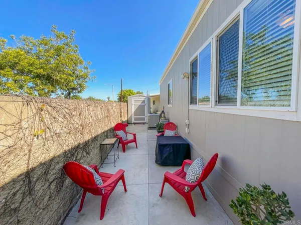a kitchen with stainless steel appliances granite countertop a refrigerator a stove and a refrigerator
