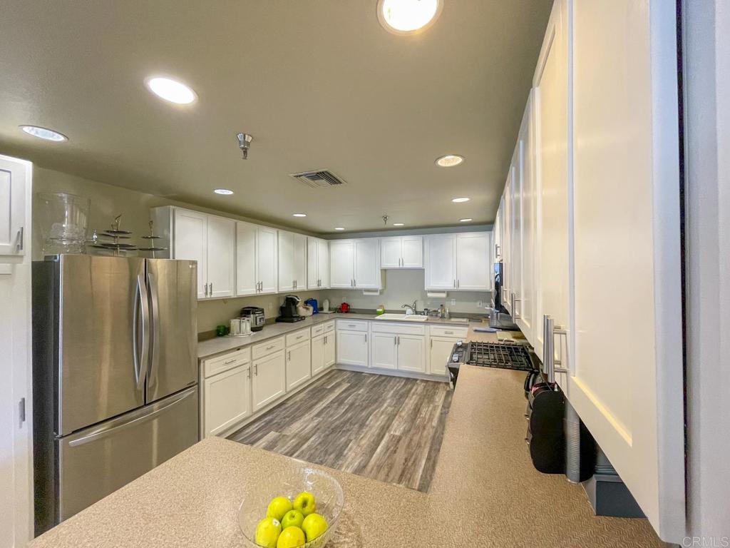 8545 Mission Gorge Road, Unit SPC 211 Santee, CA 92071 - Photo 27 of 33 a kitchen with stainless steel appliances granite countertop a refrigerator a stove and a refrigerator