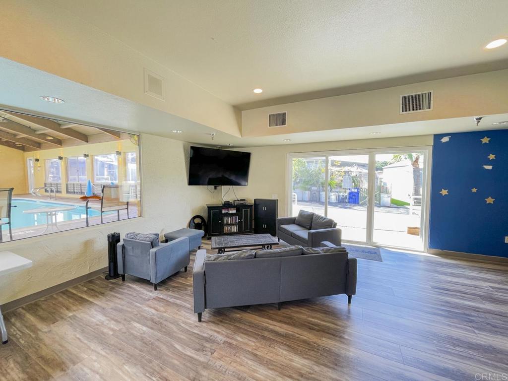 8545 Mission Gorge Road, Unit SPC 211 Santee, CA 92071 - Photo 29 of 33 a living room with furniture and a flat screen tv