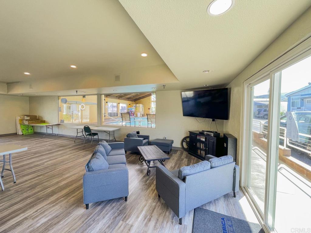 8545 Mission Gorge Road, Unit SPC 211 Santee, CA 92071 - Photo 30 of 33 a living room with furniture and a large window