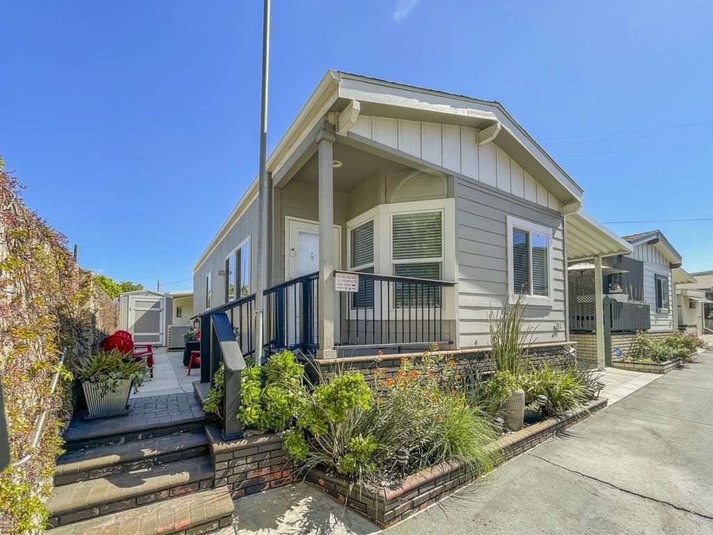 8545 Mission Gorge Road, Unit SPC 211 Santee, CA 92071 - Photo 3 of 33 a front view of a house with a yard