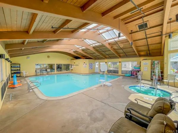 a view of a swimming pool with a patio
