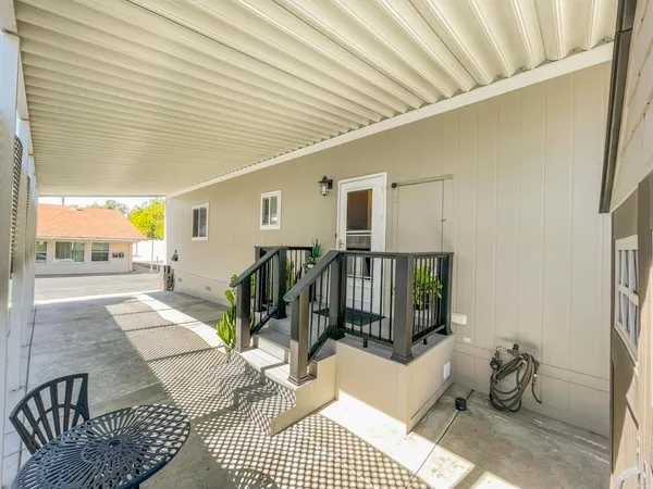 a view of a porch with seating space