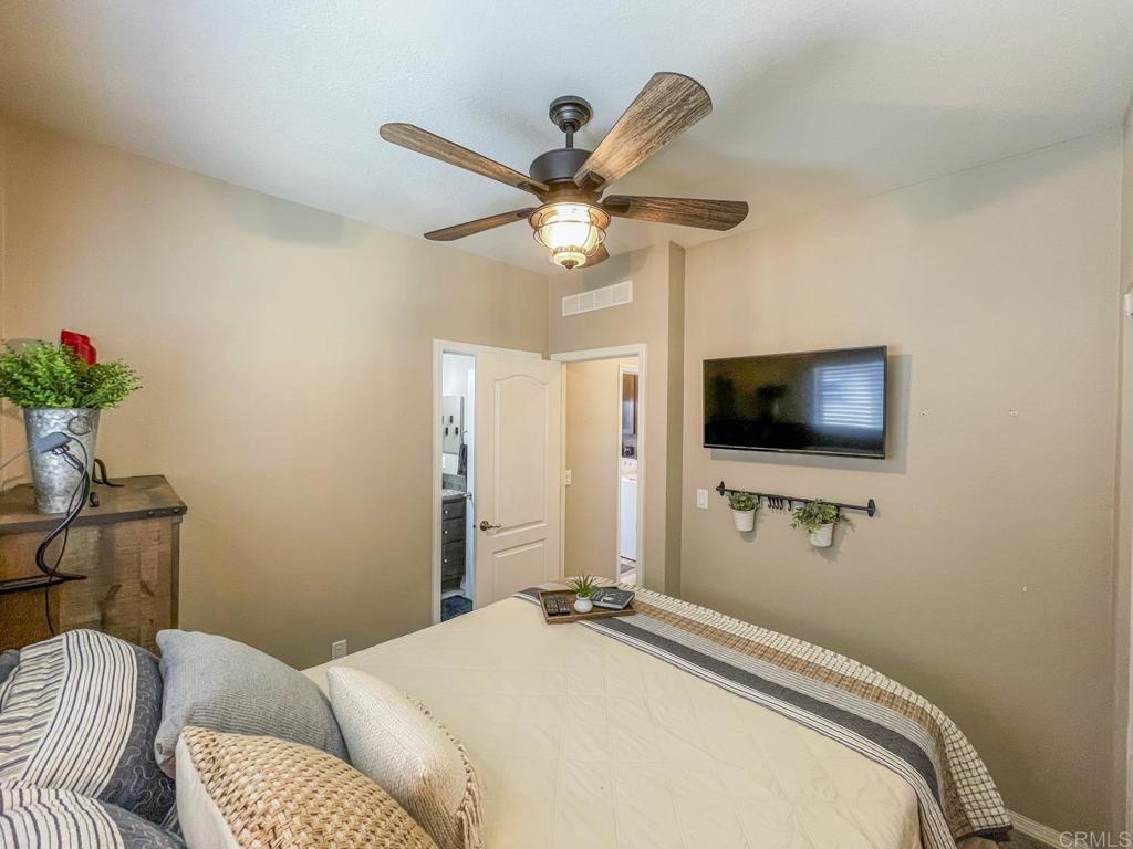 8545 Mission Gorge Road, Unit SPC 211 Santee, CA 92071 - Photo 9 of 33 a bedroom with a bed and a flat screen tv