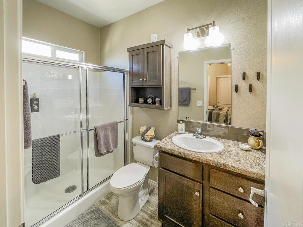 8545 Mission Gorge Road, Unit SPC 211 Santee, CA 92071 - Photo 10 of 33 a bathroom with a granite countertop sink toilet and shower