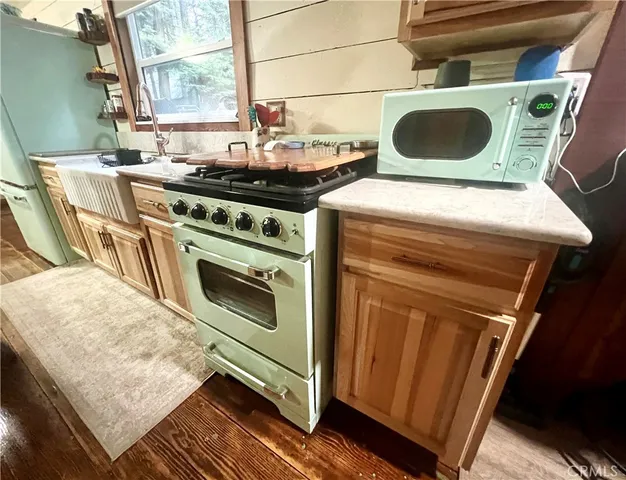 a kitchen with a stove and a sink