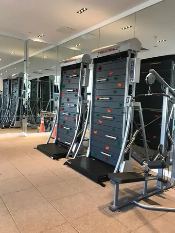 a living room with furniture and floor to ceiling windows