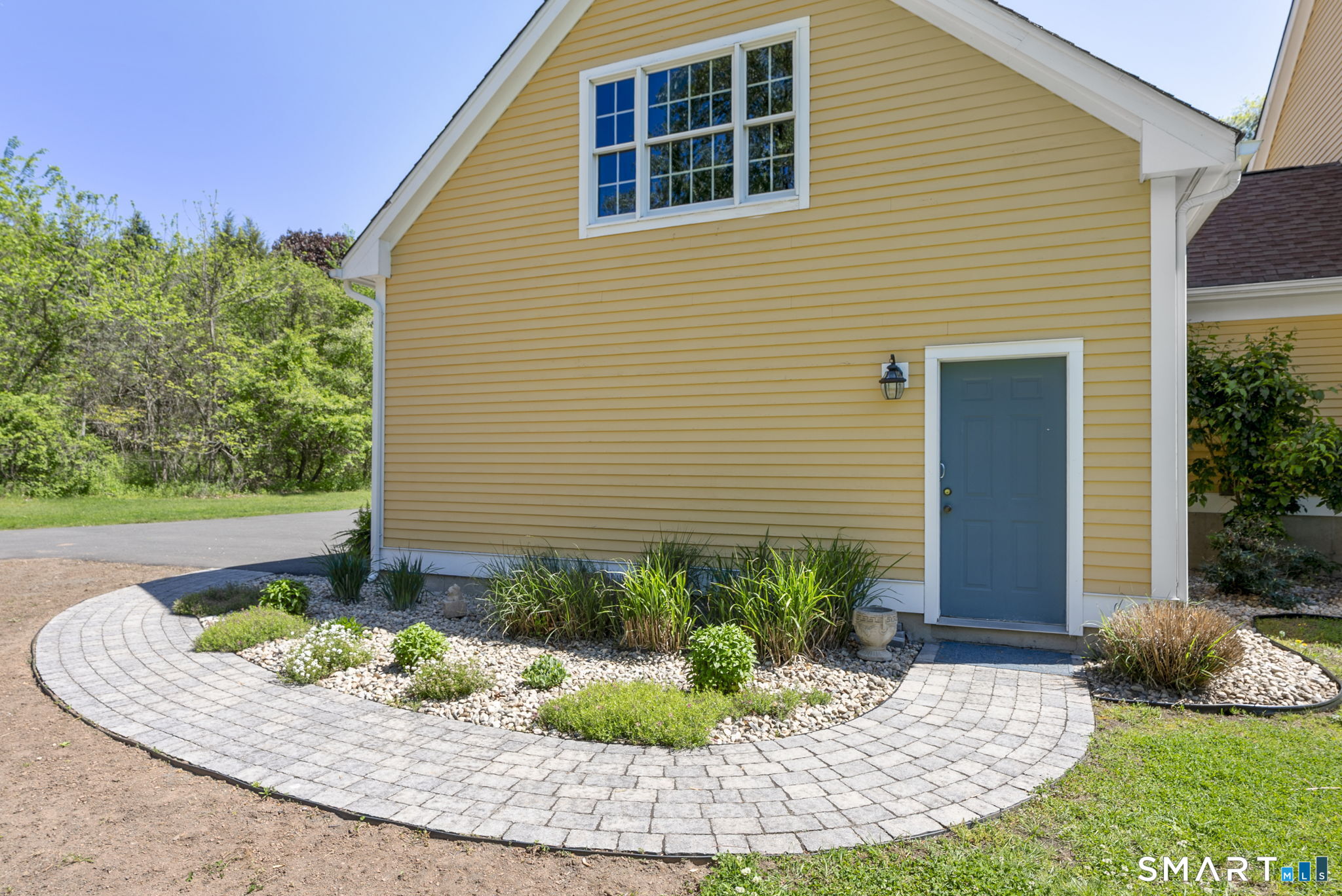 555 Waterville Road Avon, CT 06001 - Photo 7 of 40 a front view of a house with a yard