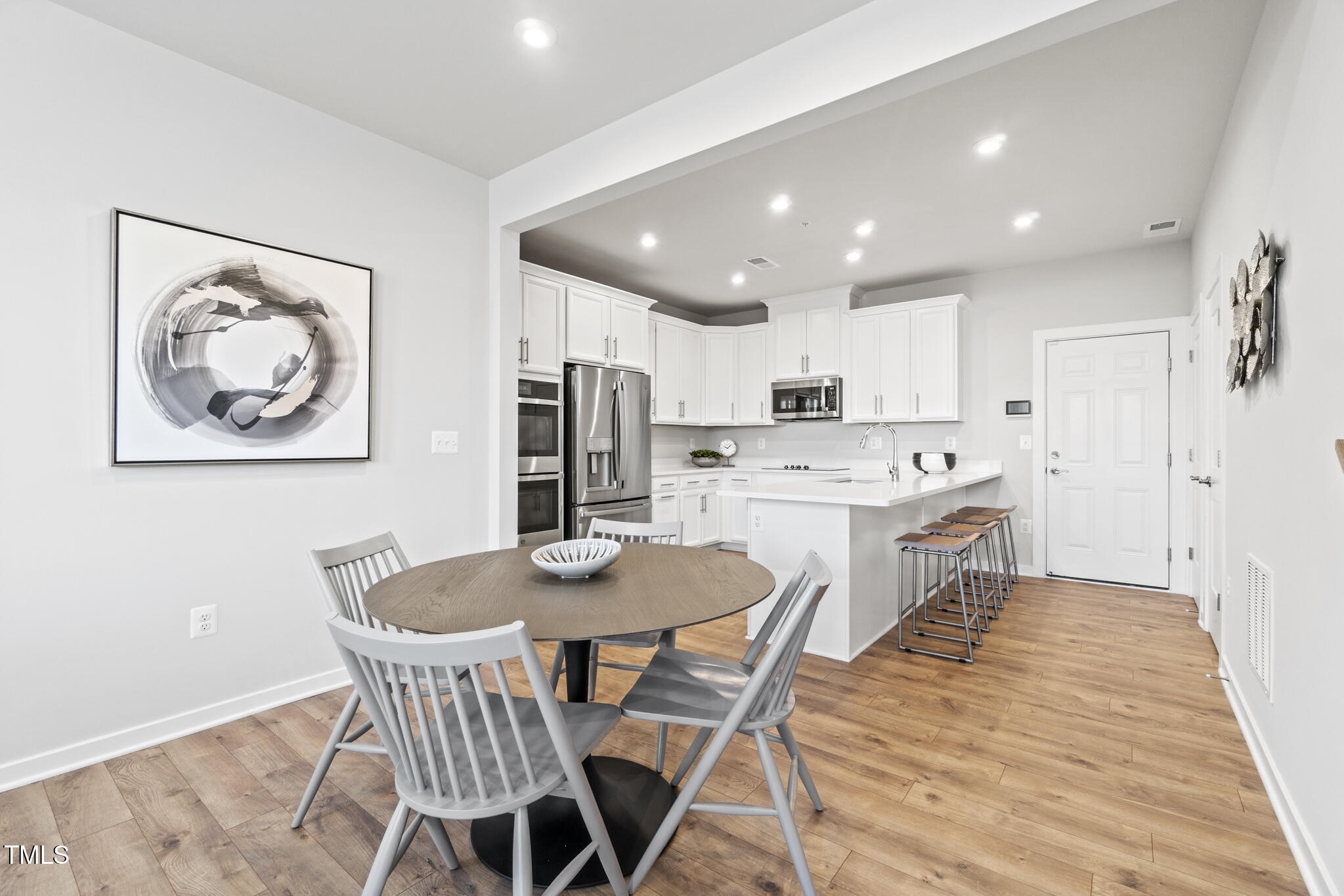 600 Hedrick Ridge Road, Unit 104 Cary, NC 27519 - Photo 3 of 35 NVA_VMP_Tessa_Model_ Dining Room