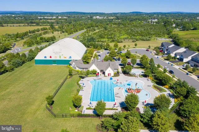 an aerial view of a house with a lake view
