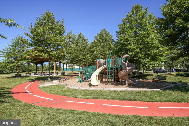 a view of a park with swings and slides