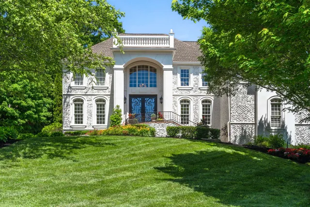 a view of house with backyard