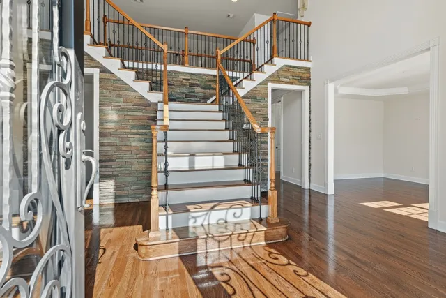 a view of entryway with wooden floor