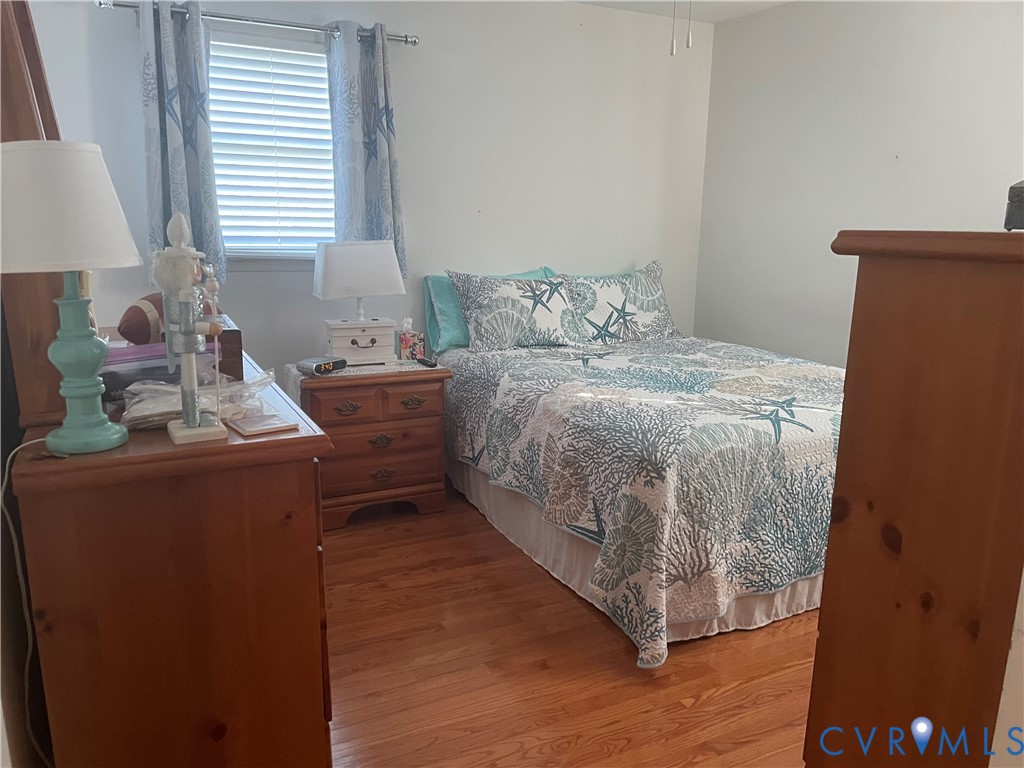 8002 Vaughan Road Petersburg, VA 23805 - Photo 12 of 28 a bedroom with a bed and a window