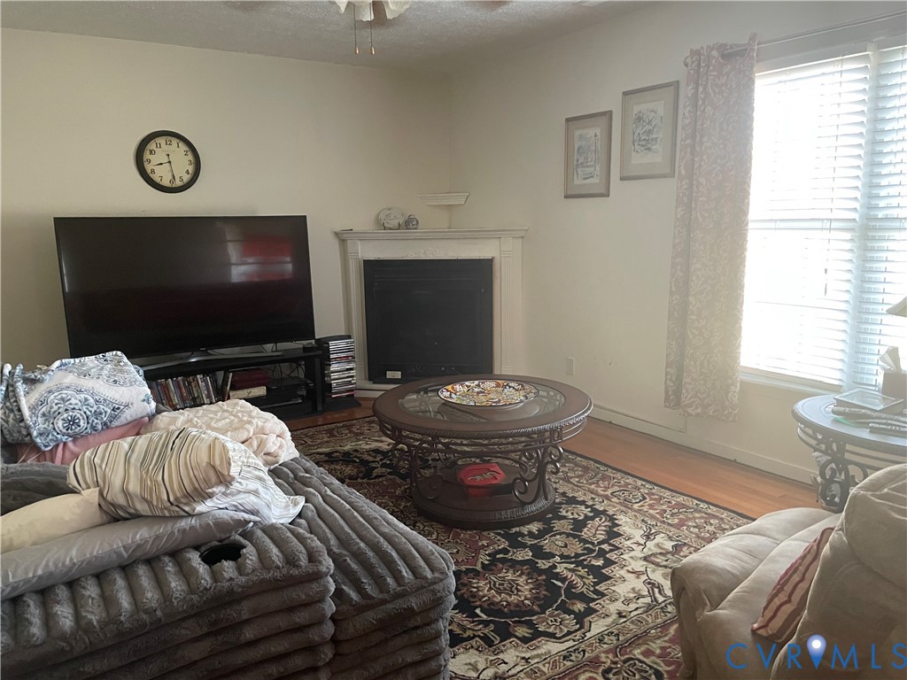 8002 Vaughan Road Petersburg, VA 23805 - Photo 17 of 28 a living room with furniture and a flat screen tv