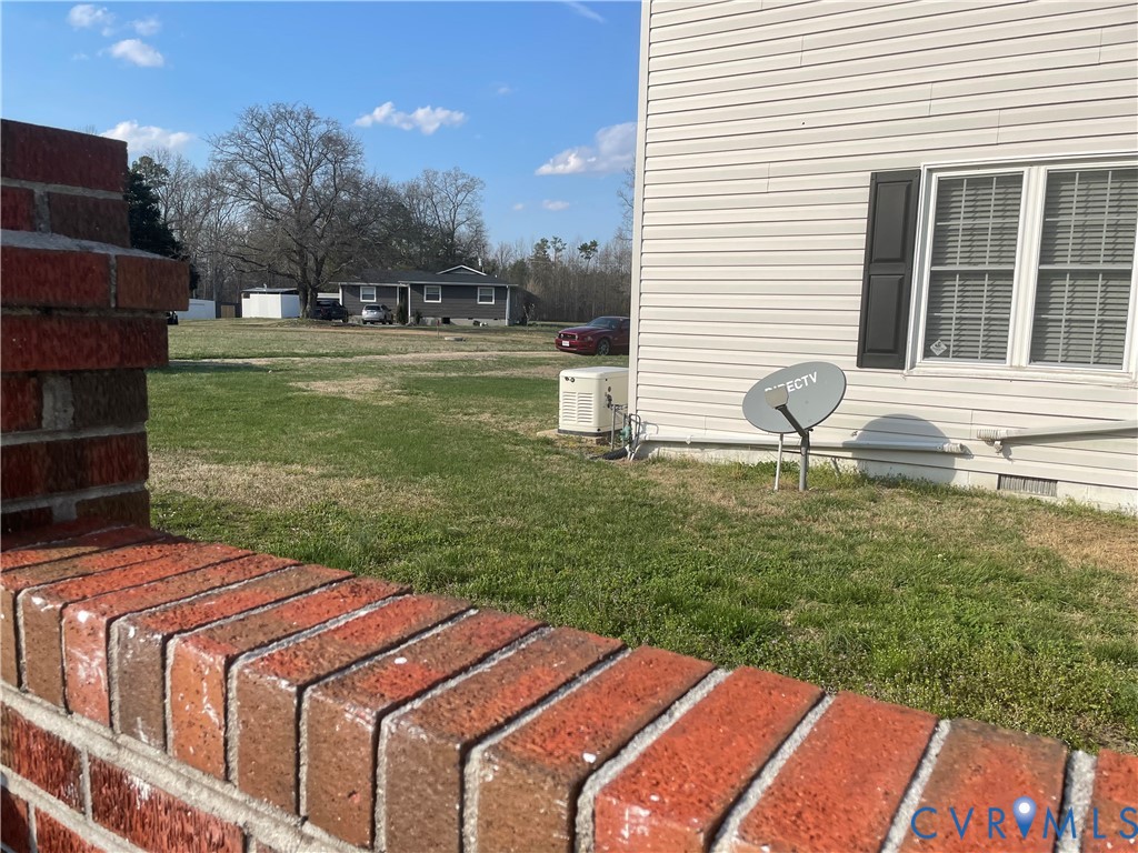 8002 Vaughan Road Petersburg, VA 23805 - Photo 25 of 28 a front view of a house with garden