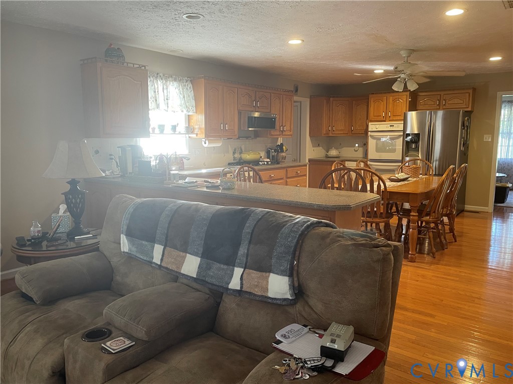 8002 Vaughan Road Petersburg, VA 23805 - Photo 3 of 28 a living room with furniture and wooden floor