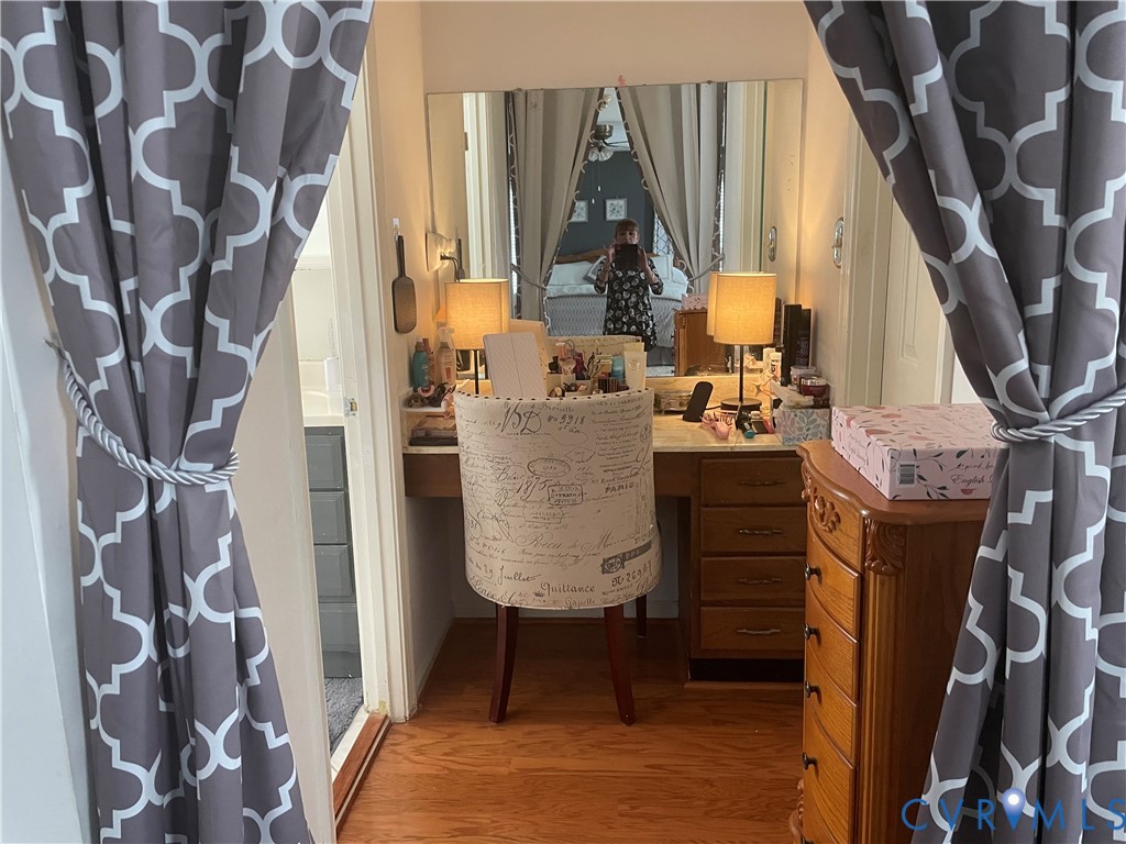 8002 Vaughan Road Petersburg, VA 23805 - Photo 6 of 28 a bed room with a bed and a fireplace