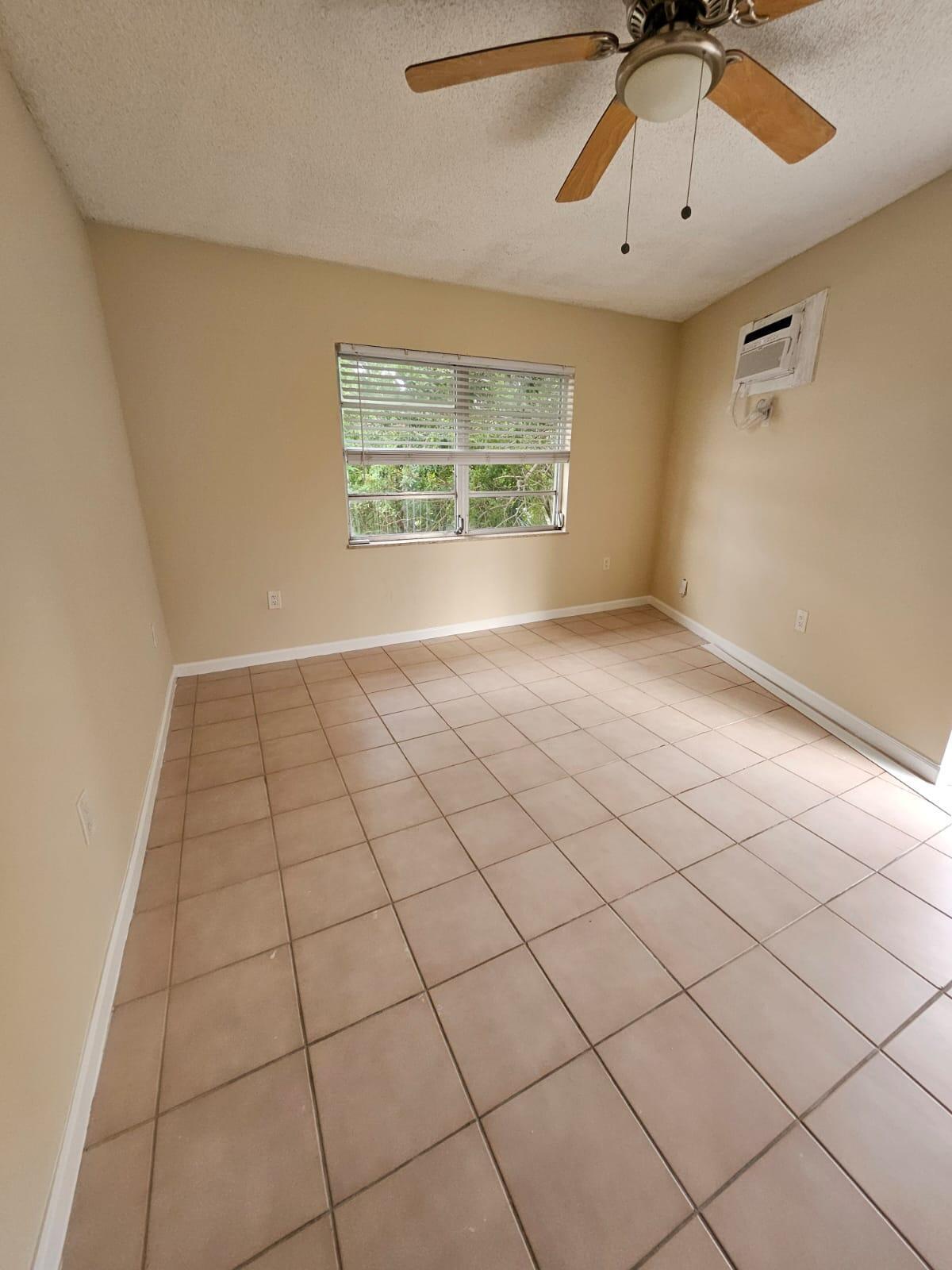 1232 Southwest 30th Court Miami, FL 33135 - Photo 12 of 13 a view of an empty room and a window