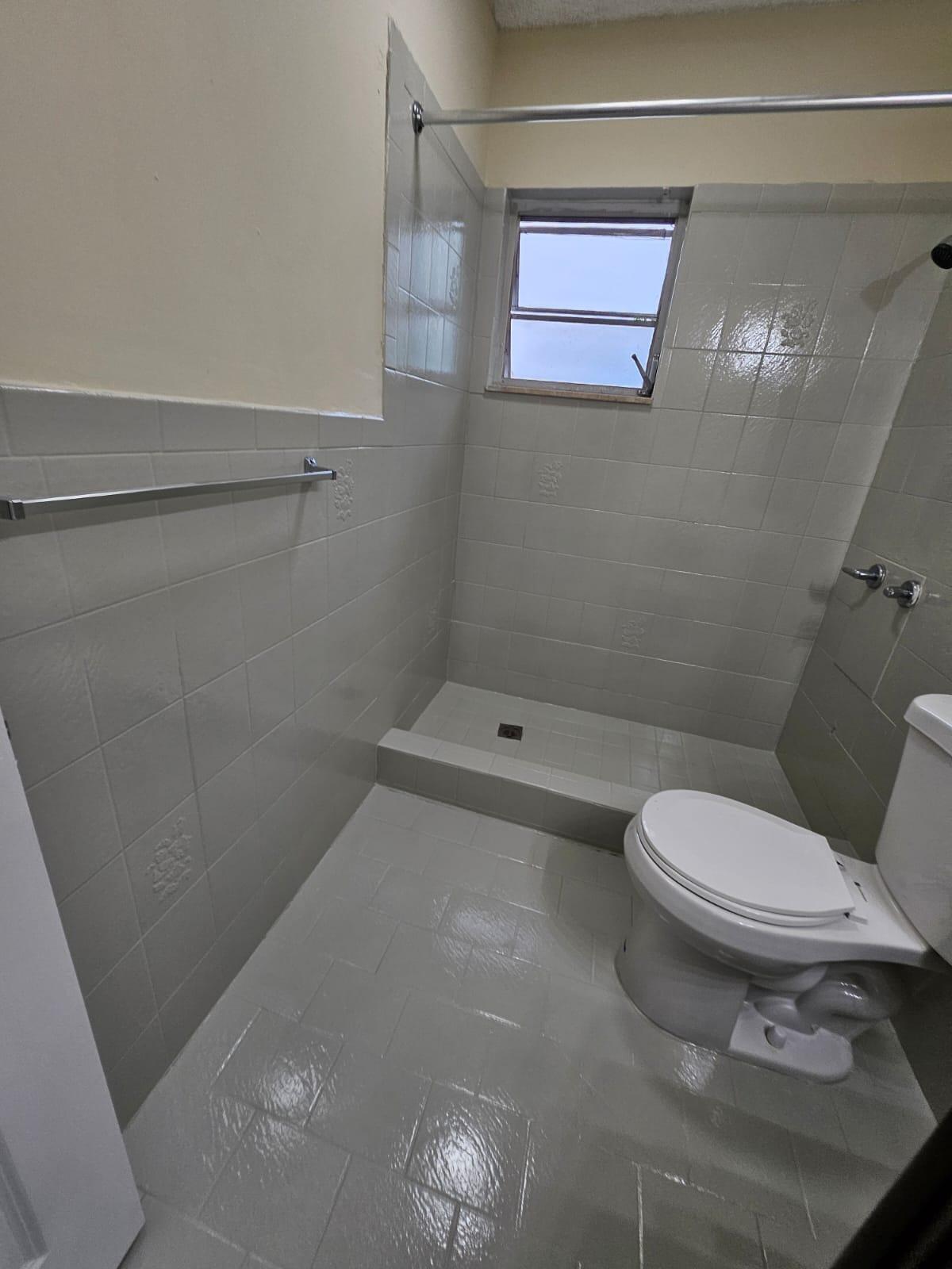1232 Southwest 30th Court Miami, FL 33135 - Photo 2 of 13 a bathroom with a toilet and a shower