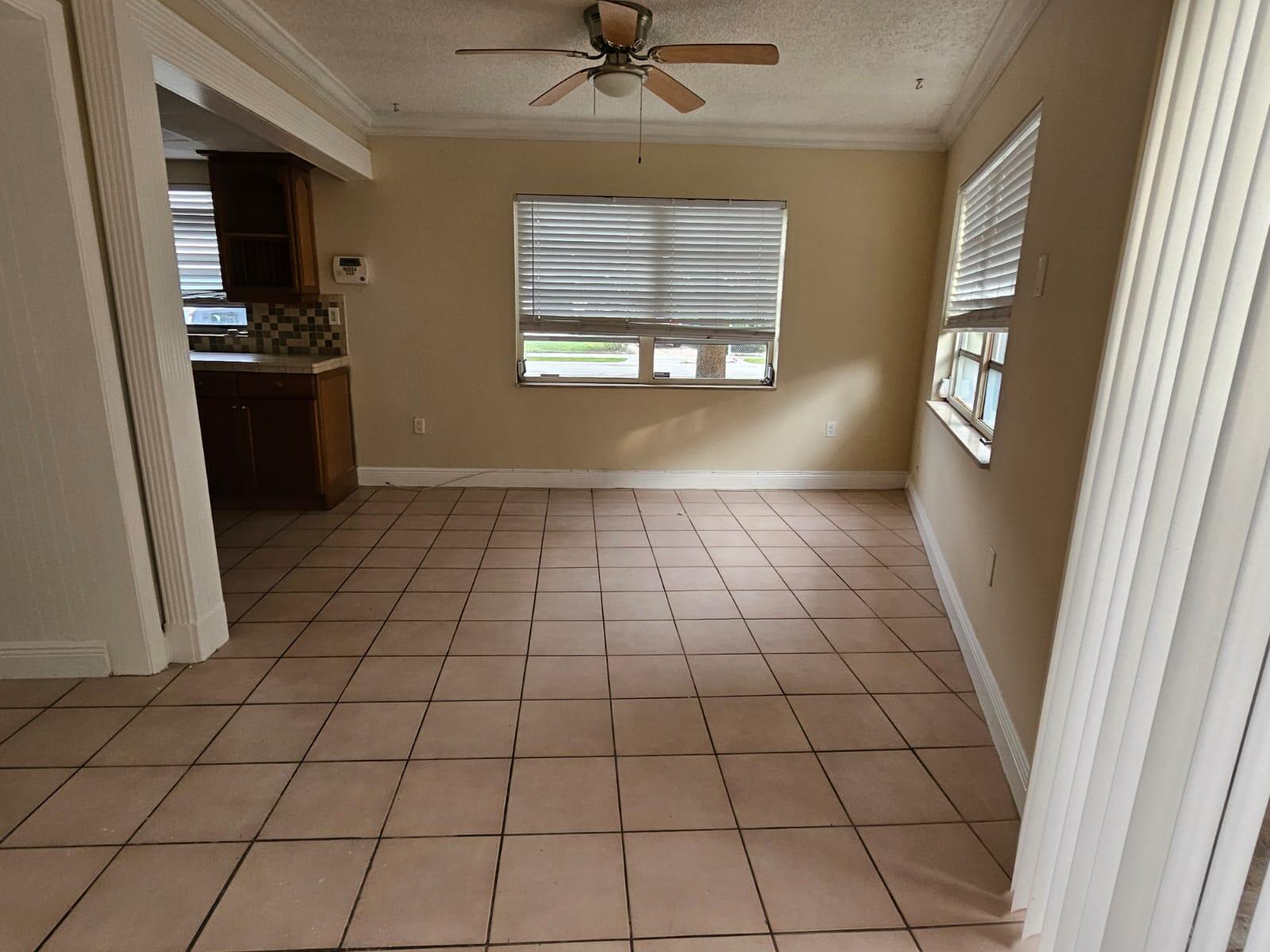 1232 Southwest 30th Court Miami, FL 33135 - Photo 4 of 13 a view of an empty room and a window