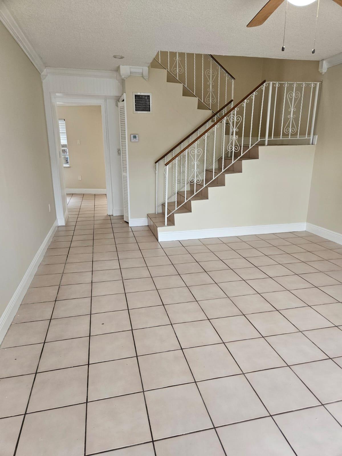 1232 Southwest 30th Court Miami, FL 33135 - Photo 5 of 13 a view of a livingroom with white floor and white walls