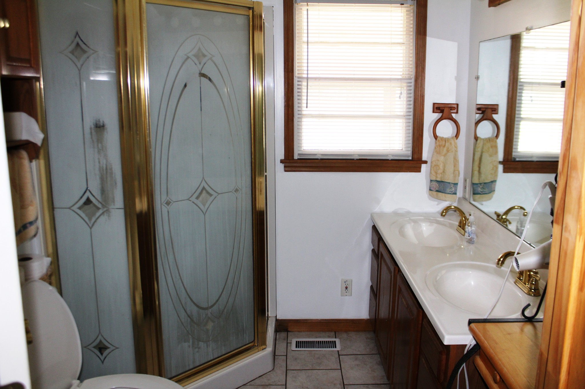 3847 Shellsford Road McMinnville, TN 37110 - Photo 16 of 34 a bathroom with a sink a mirror and a window