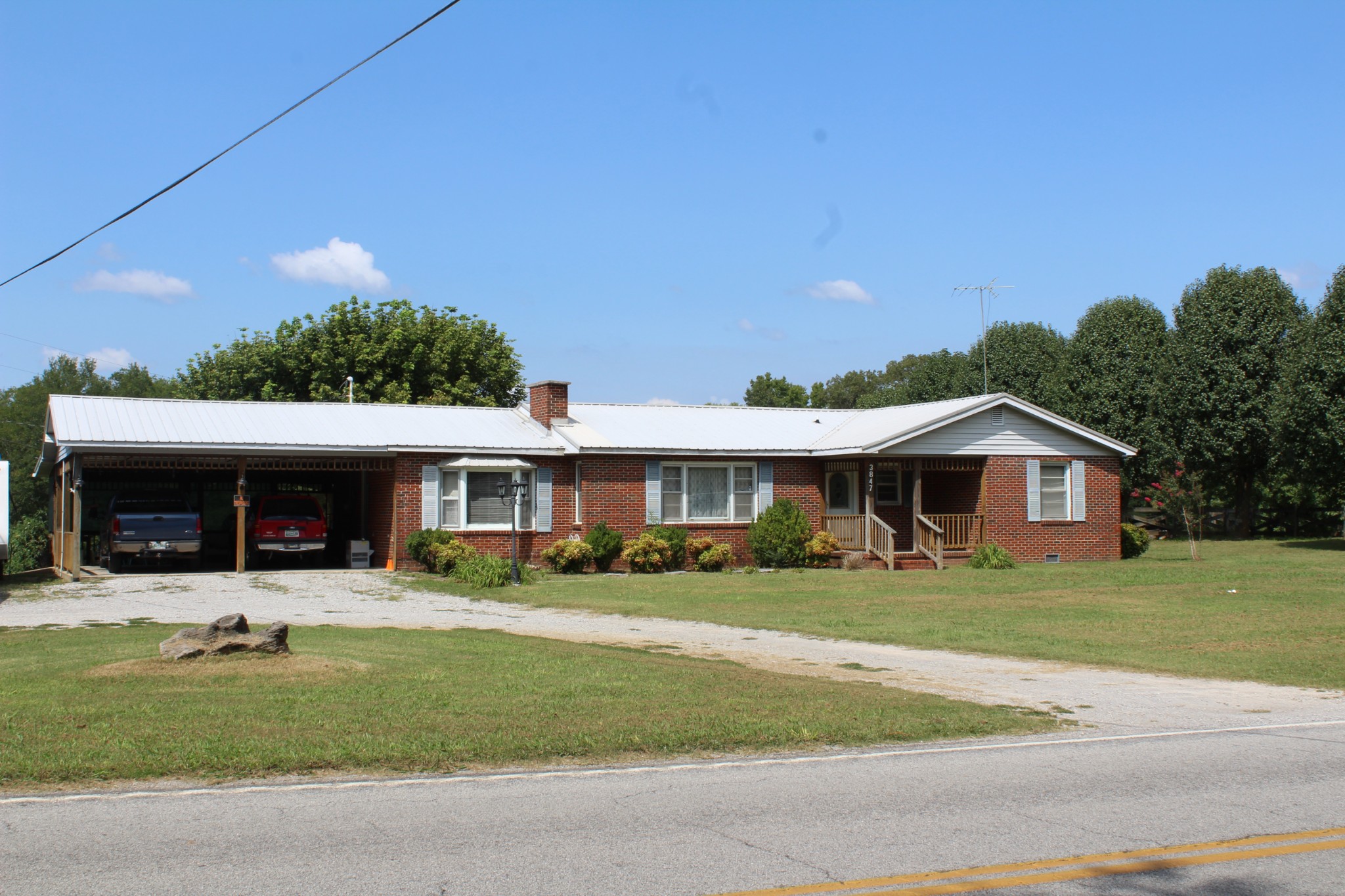 3847 Shellsford Road McMinnville, TN 37110 - Photo 21 of 34 a front view of a house with a yard and garage