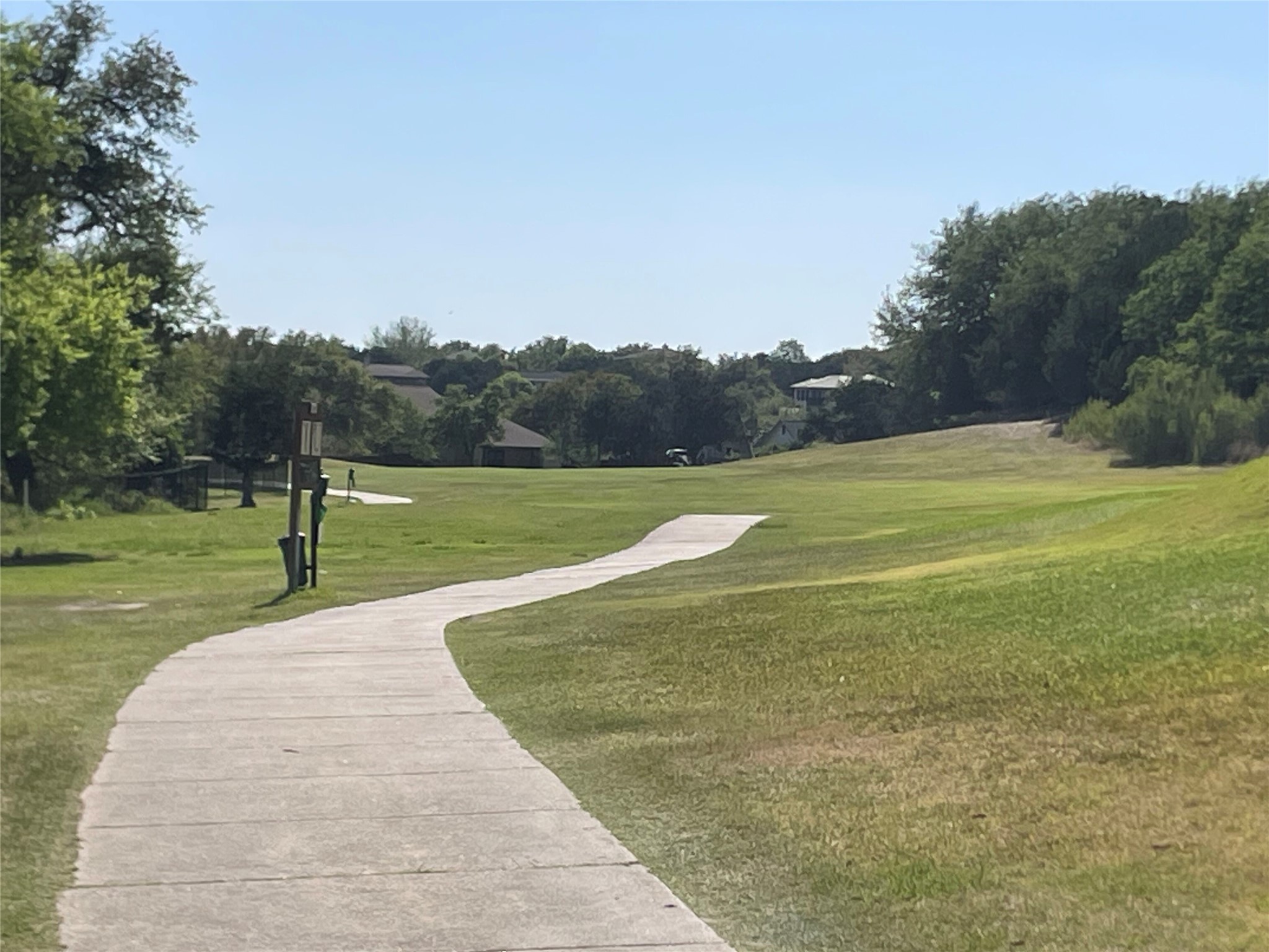 301 Augusta Cove Lago Vista, TX 78645 - Photo 8 of 17 a view of a golf course with a yard