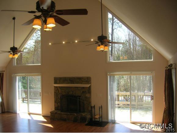191 Big Cedar Drive Rutherfordton, NC 28139 - Photo 2 of 24 a living room with a fireplace furniture and a large window