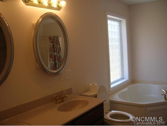 191 Big Cedar Drive Rutherfordton, NC 28139 - Photo 12 of 24 a bathroom with a sink a toilet and a mirror