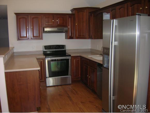 191 Big Cedar Drive Rutherfordton, NC 28139 - Photo 5 of 24 a kitchen with stainless steel appliances granite countertop a refrigerator and a stove