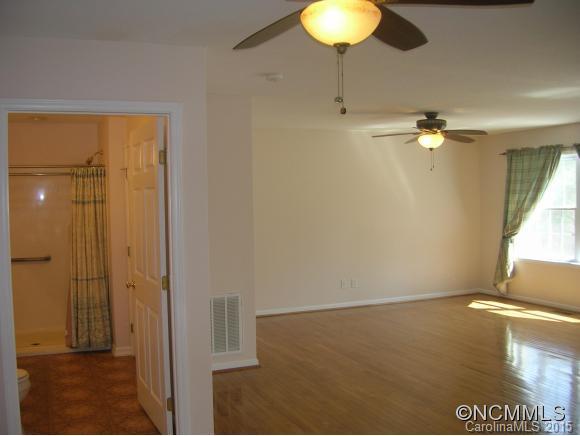 191 Big Cedar Drive Rutherfordton, NC 28139 - Photo 8 of 24 wooden floor in an empty room with a window