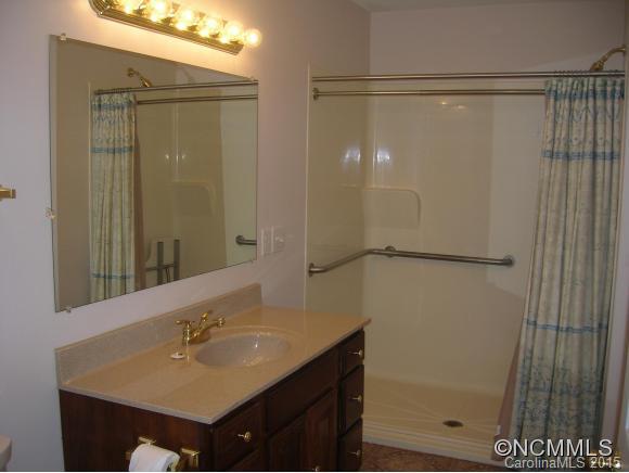 191 Big Cedar Drive Rutherfordton, NC 28139 - Photo 9 of 24 a bathroom with a shower sink and mirror