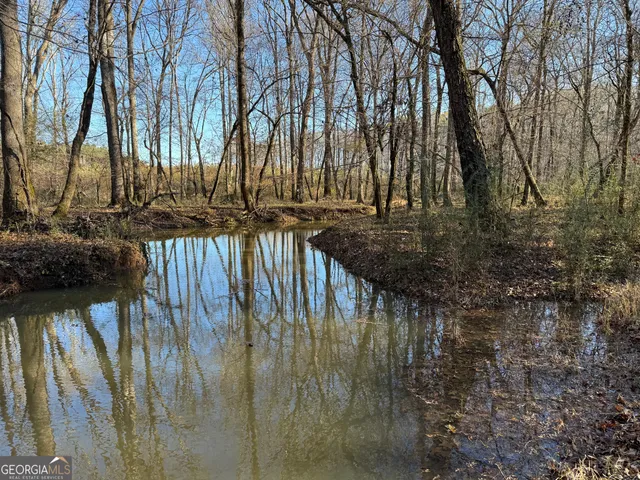 a view of swimming pool with a patio