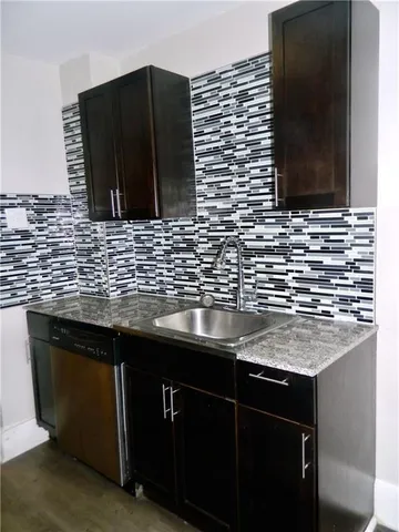 a bathroom with a sink and a microwave