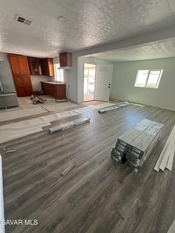 a living room with furniture window and a table