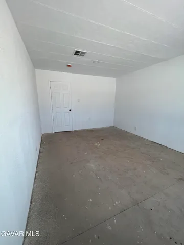 a room with a cabinets and a table