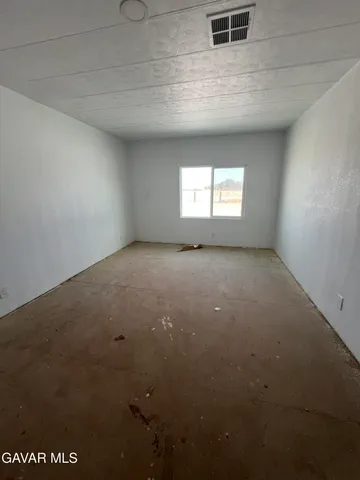a view of empty room with windows