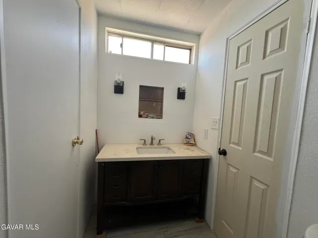 a view of a big room with a wooden walls