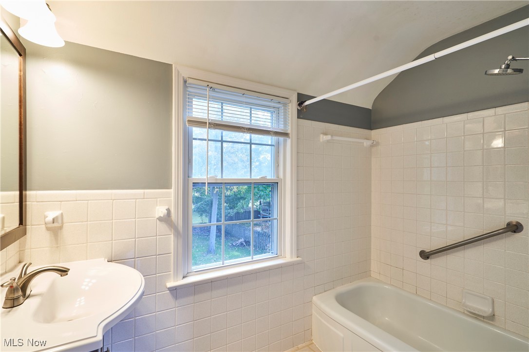 1111 Ford Road Lyndhurst, OH 44124 - Photo 16 of 27 Bathroom with vanity, tile walls, and tiled shower / bath