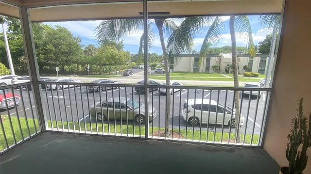 a view of a park with a large window