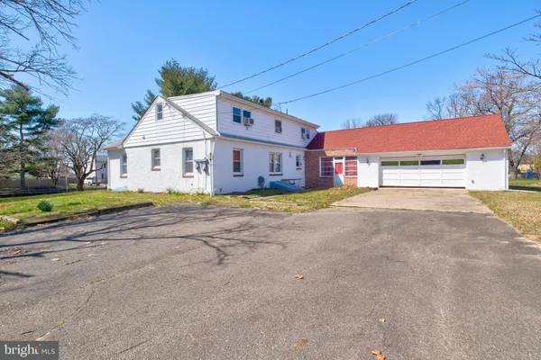 front view of a house with a big yard
