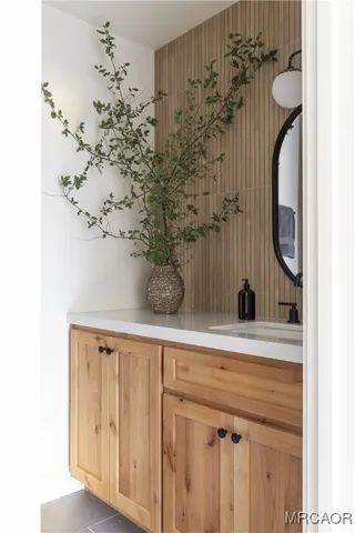 a bathroom with a sink and mirror
