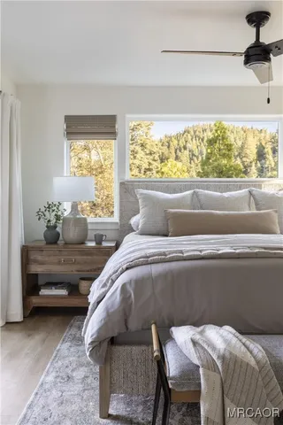 a bedroom with a bed and window