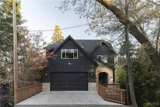 a front view of a house with a garage