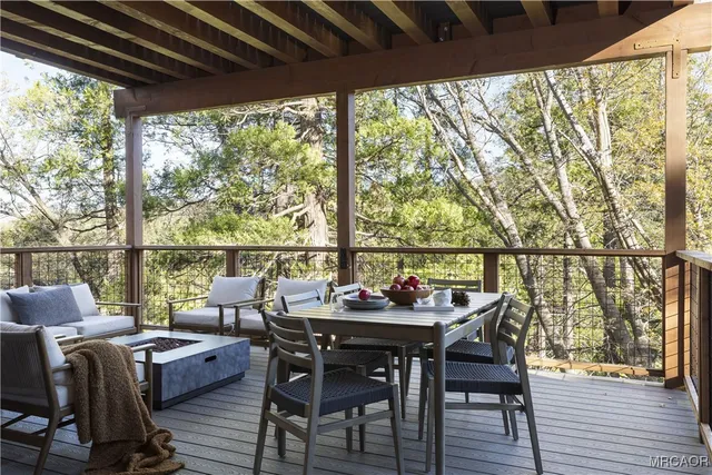 a view of deck with furniture and outside view