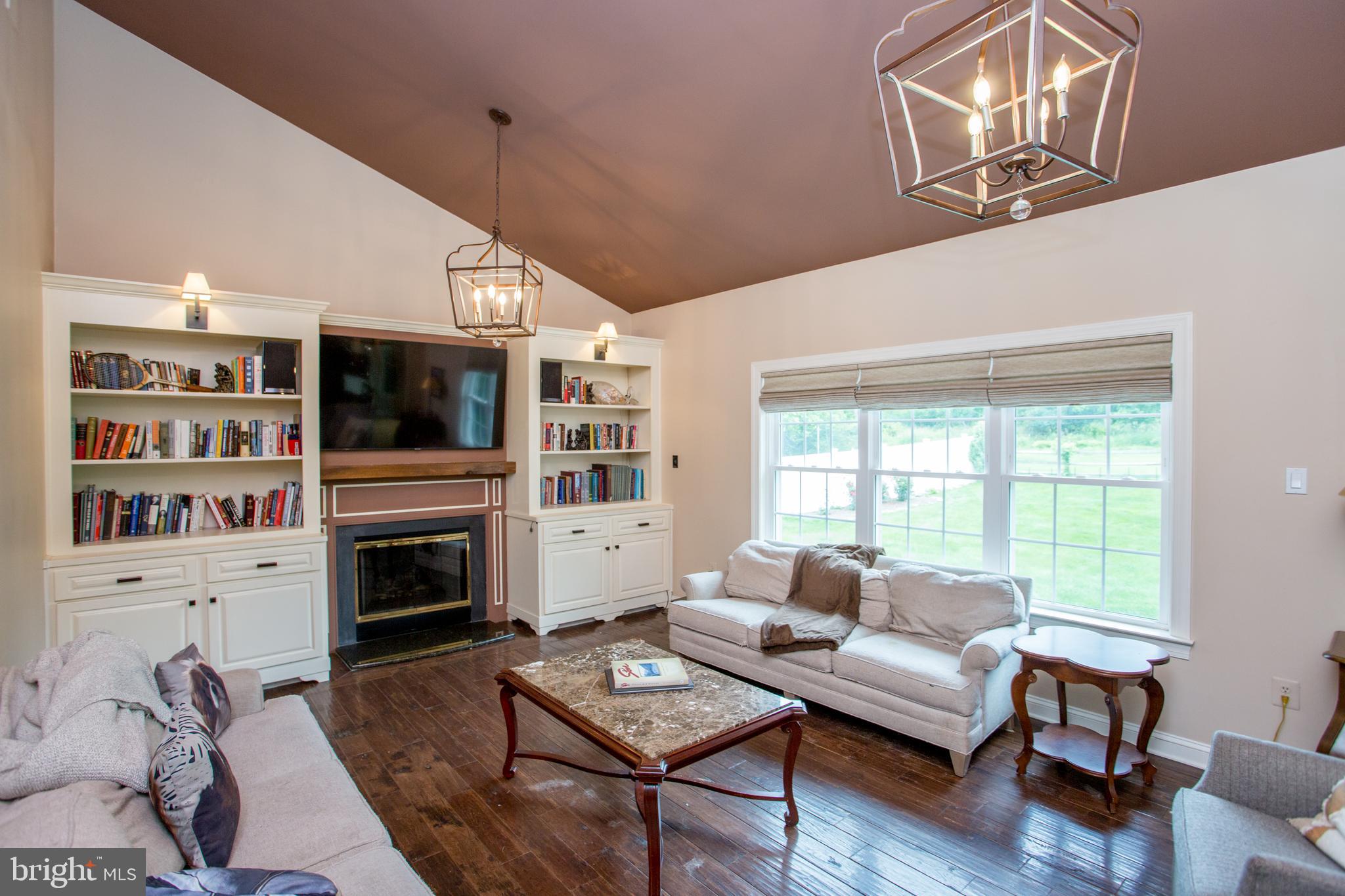 3879 Charter Club Drive Doylestown, PA 18902 - Photo 25 of 54 Hand scraped hickory flooring & custom wood mantel