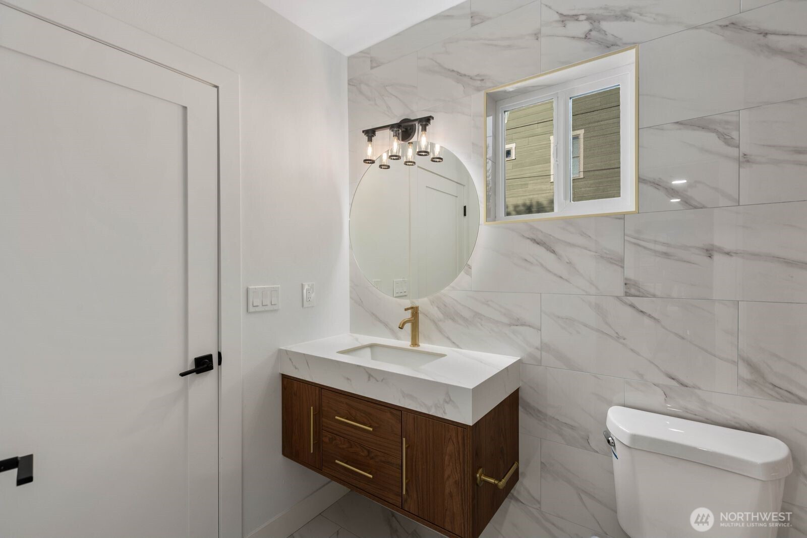 512 Northwest 44th Street Seattle, WA 98107 - Photo 14 of 37 a bathroom with a sink toilet and shower