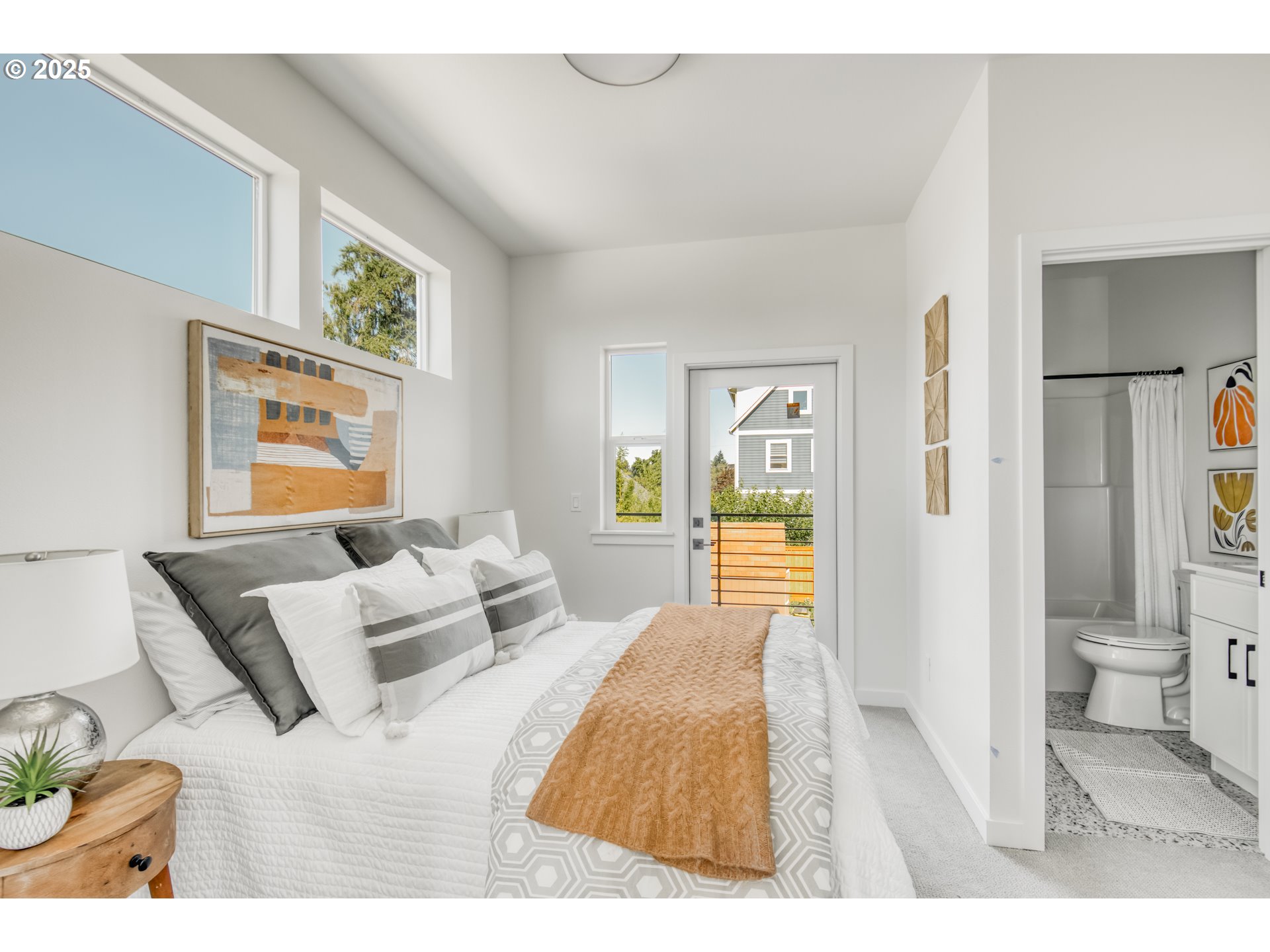 6802 Northeast 6th Avenue Portland, OR 97211 - Photo 14 of 23 a bedroom with a bed and a couch